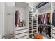 Organized walk-in closet with shelving, hanging racks, and a dedicated space for shoe storage at 184 Wildfell Trl, Cary, NC 27513