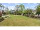 Expansive backyard with manicured lawn, landscaping and an iron fence at 200 Windy Knoll Cir, Chapel Hill, NC 27516