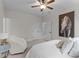 Spacious bedroom featuring a ceiling fan, a decorative painting, and a large comfy chair at 200 Windy Knoll Cir, Chapel Hill, NC 27516