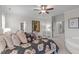 Spacious bedroom with floral bedding, neutral walls, ceiling fan and ensuite bath at 200 Windy Knoll Cir, Chapel Hill, NC 27516
