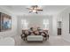 Serene bedroom featuring neutral walls, ceiling fan, and lots of natural light through the windows at 200 Windy Knoll Cir, Chapel Hill, NC 27516