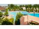 A community pool featuring lounge chairs, umbrellas, and a winding water slide at 200 Windy Knoll Cir, Chapel Hill, NC 27516
