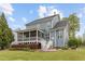 Well-maintained home exterior with a screened porch and beautifully landscaped backyard at 200 Windy Knoll Cir, Chapel Hill, NC 27516