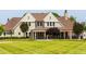 Beautiful two-story home with a well-manicured front lawn and covered porch at 200 Windy Knoll Cir, Chapel Hill, NC 27516