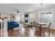 Open concept living space with fireplace, hardwood floors, and ample natural light at 200 Windy Knoll Cir, Chapel Hill, NC 27516