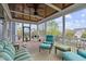 Comfortable screened porch featuring wood ceiling, ceiling fan, and lovely furniture at 200 Windy Knoll Cir, Chapel Hill, NC 27516