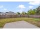 Fenced backyard with a grass lawn, concrete patio, and ample space for outdoor enjoyment at 205 Loxton St, Fuquay Varina, NC 27526