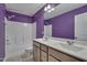 Modern bathroom with double sink vanity, a shower-tub combo, and stylish fixtures at 205 Loxton St, Fuquay Varina, NC 27526