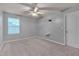 Bright and spacious bedroom with a ceiling fan and ample natural light from the large window at 205 Loxton St, Fuquay Varina, NC 27526