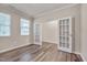 Well-lit bedroom featuring hardwood floors and stylish French doors at 205 Loxton St, Fuquay Varina, NC 27526