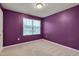 Cozy bedroom featuring plush carpet, a bright window, and painted walls at 205 Loxton St, Fuquay Varina, NC 27526
