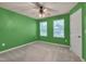 Bright bedroom with a ceiling fan, painted walls, carpet, and a window at 205 Loxton St, Fuquay Varina, NC 27526