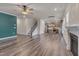 Spacious living room features modern flooring, fireplace, and seamlessly connects to a well-equipped kitchen at 205 Loxton St, Fuquay Varina, NC 27526