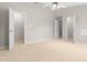 Bedroom with a ceiling fan, neutral carpet, and two closets at 2101 Piney Brook Rd # 105, Raleigh, NC 27614