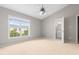 Bright bedroom with neutral carpet, a ceiling fan, and an ensuite bathroom at 2101 Piney Brook Rd # 105, Raleigh, NC 27614