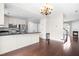 Modern kitchen featuring stainless steel appliances, granite countertops, and hardwood floors at 2101 Piney Brook Rd # 105, Raleigh, NC 27614