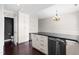 Bright kitchen featuring modern appliances, granite counters, and hardwood floors at 2101 Piney Brook Rd # 105, Raleigh, NC 27614