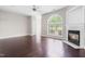 Spacious living room featuring hardwood floors, a ceiling fan, and a fireplace at 2101 Piney Brook Rd # 105, Raleigh, NC 27614