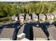 Wide aerial view of a residential area showcasing neat rows of houses and mature trees at 2123 Gregor Overlook Ln, Apex, NC 27502