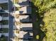 Overhead view of a quiet neighborhood with tree-lined streets and well-kept homes at 2123 Gregor Overlook Ln, Apex, NC 27502