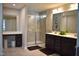 Modern Primary bathroom with double vanity sinks, vanity table, a glass-enclosed shower, and neutral tones at 2123 Gregor Overlook Ln, Apex, NC 27502