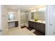 Modern Primary bathroom with double vanity sinks, vanity table and a glass-enclosed shower at 2123 Gregor Overlook Ln, Apex, NC 27502