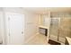 Bathroom showcasing a tiled shower with glass doors, a vanity with seating, and a towel rack at 2123 Gregor Overlook Ln, Apex, NC 27502