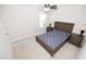Spacious bedroom with a ceiling fan, window, and a bed with wooden frame and matching nightstands at 2123 Gregor Overlook Ln, Apex, NC 27502