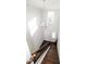 Bright foyer showcasing a chandelier, staircase with wooden railing, and natural light at 2123 Gregor Overlook Ln, Apex, NC 27502