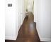 Hallway features hardwood floors and a neutral color scheme that enhances the modern aesthetic at 2123 Gregor Overlook Ln, Apex, NC 27502