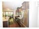 Modern kitchen with dark cabinets, stainless steel appliances, and a granite island countertop at 2123 Gregor Overlook Ln, Apex, NC 27502