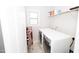 Laundry room with modern washer and dryer, storage shelves, and natural light at 2123 Gregor Overlook Ln, Apex, NC 27502
