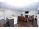 Spacious living room and kitchen with hardwood floors, fireplace, and modern furnishings at 2123 Gregor Overlook Ln, Apex, NC 27502