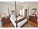 Classic bedroom featuring a four poster bed, hardwood floors, and detailed crown molding at 228 Old Colony Way, Rocky Mount, NC 27804