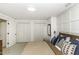 Bedroom featuring neutral colored carpet, a large closet, and paneled walls at 228 Old Colony Way, Rocky Mount, NC 27804
