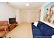 Comfortable living room with bright walls, a plush sofa, and a wall mounted television at 228 Old Colony Way, Rocky Mount, NC 27804