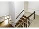 Bright staircase with hardwood stairs and banister, white trim, and plenty of natural light at 228 Old Colony Way, Rocky Mount, NC 27804