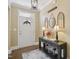 Welcoming entryway featuring a console table, decorative mirrors, and stylish lamps at 2308 Swansea Ln, Apex, NC 27502