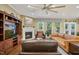 Cozy living room with a fireplace, large windows, and a comfortable seating arrangement at 2308 Swansea Ln, Apex, NC 27502