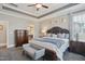 Spacious main bedroom with large windows, a king bed, and a serene color scheme at 2308 Swansea Ln, Apex, NC 27502