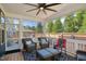 Relaxing screened porch with cozy seating, outdoor views, and ample space for entertainment at 2308 Swansea Ln, Apex, NC 27502