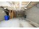 Spacious unfinished basement with block walls, exposed ceiling, and a storage area at 233 Sweet Bay Pl, Carrboro, NC 27510