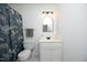 Bathroom featuring a shower with blue floral curtains, decor, and modern vanity creates a stylish space at 233 Sweet Bay Pl, Carrboro, NC 27510