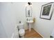 Bathroom featuring a pedestal sink, decor, and toilet enhancing its functional space at 233 Sweet Bay Pl, Carrboro, NC 27510