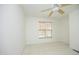 Bright bedroom featuring neutral carpet, a ceiling fan, and a window with wood blinds at 233 Sweet Bay Pl, Carrboro, NC 27510