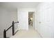 Bright hallway with white walls, carpeted floor, and multiple doors for easy access to rooms at 233 Sweet Bay Pl, Carrboro, NC 27510