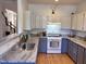 Well-lit kitchen with granite countertops, stainless steel sink, and modern appliances at 233 Sweet Bay Pl, Carrboro, NC 27510