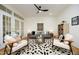 Comfortable living room with hardwood floors, stylish seating, and bright lighting at 233 Sweet Bay Pl, Carrboro, NC 27510