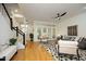 Bright living room featuring hardwood floors, staircase, and comfortable seating area at 233 Sweet Bay Pl, Carrboro, NC 27510
