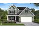Charming two-story home with a two car garage and a landscaped yard at 25 Malbec Way, Youngsville, NC 27596